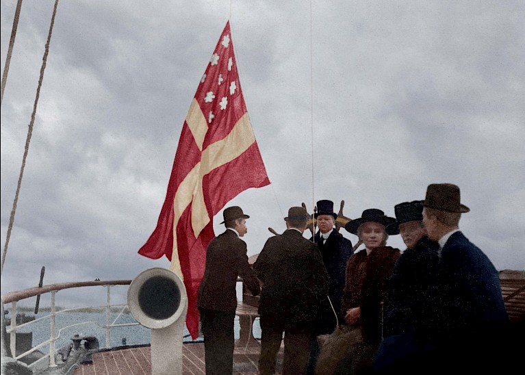 Hoisting the flag onboard s/v Sylfid.